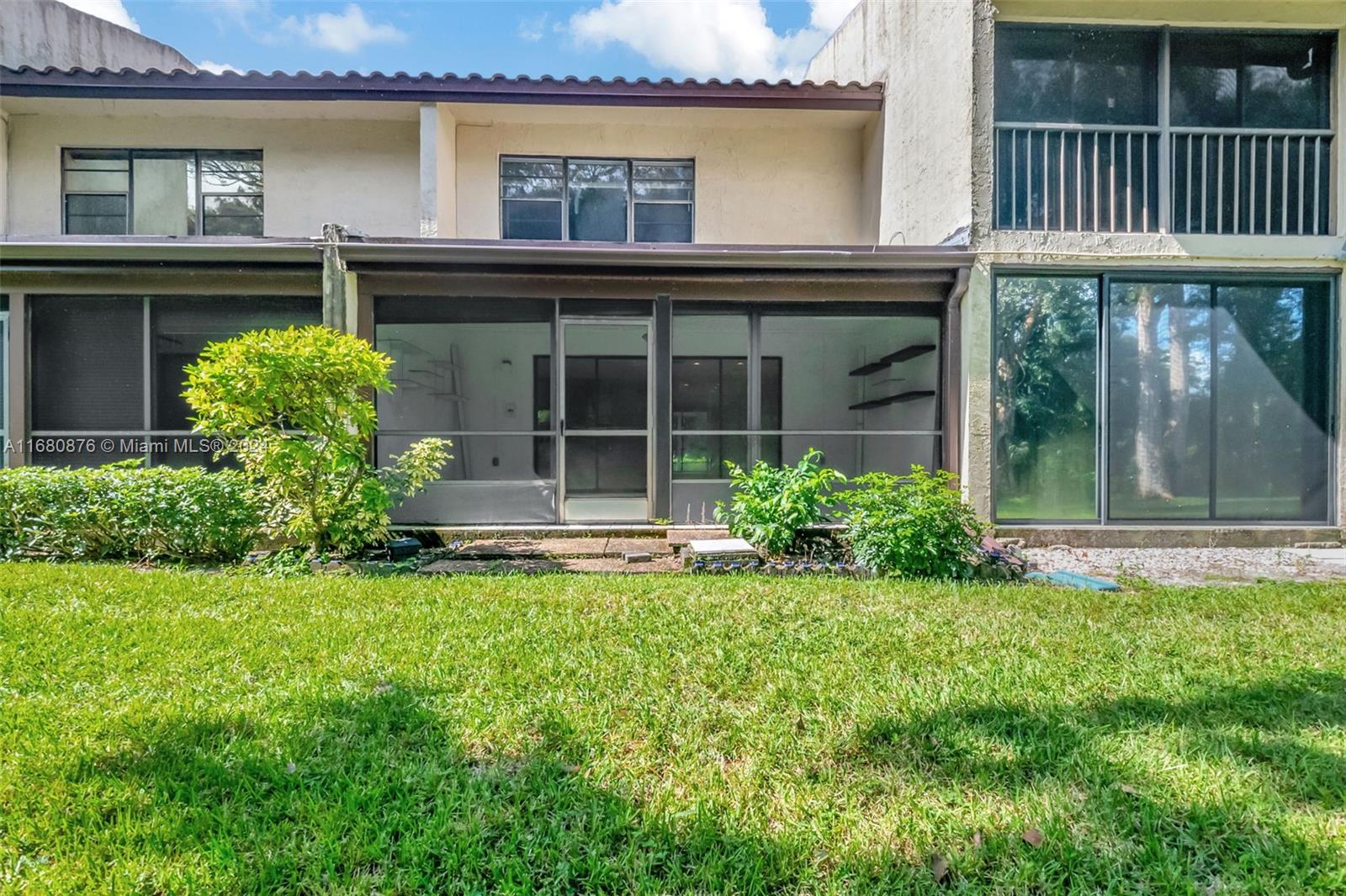 21864 Arriba Real, Unit 3E Boca Raton, FL 33433 - Photo 41 of 61 front view of a house with a yard