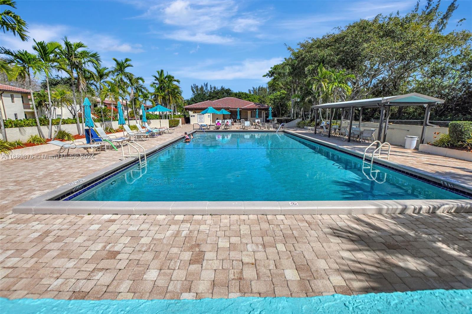 21864 Arriba Real, Unit 3E Boca Raton, FL 33433 - Photo 46 of 61 a view of a swimming pool with a patio