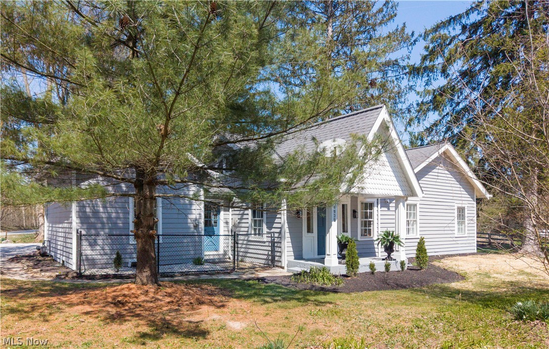 14939 Caves Road Novelty, OH 44072 - Photo 41 of 42 View of front facade with covered porch and roof with shingles