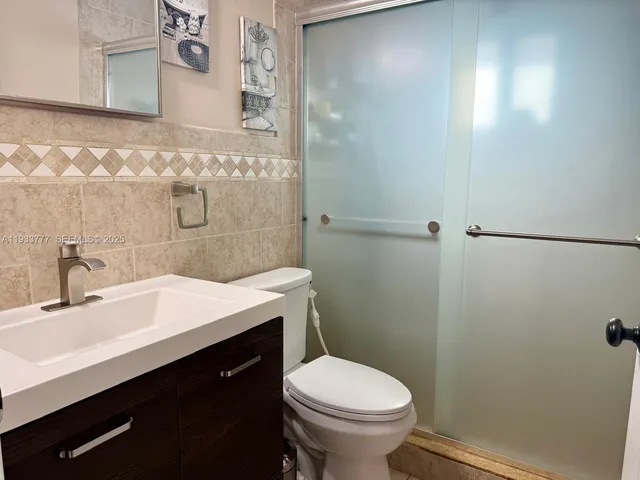 a bathroom with a sink and a toilet