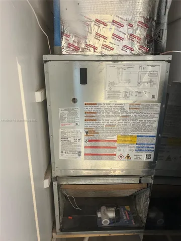 a stove top oven sitting inside of a kitchen