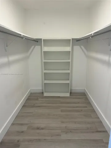 a view of an empty walk in closet