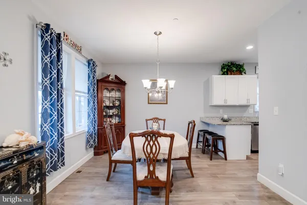 a kitchen with stainless steel appliances granite countertop a stove a refrigerator and a sink