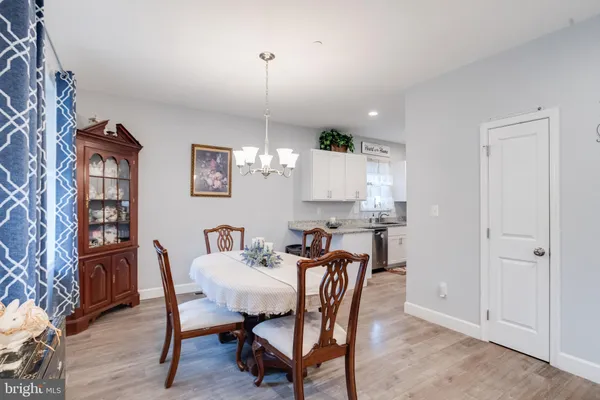 a kitchen with stainless steel appliances granite countertop a sink stove microwave and refrigerator