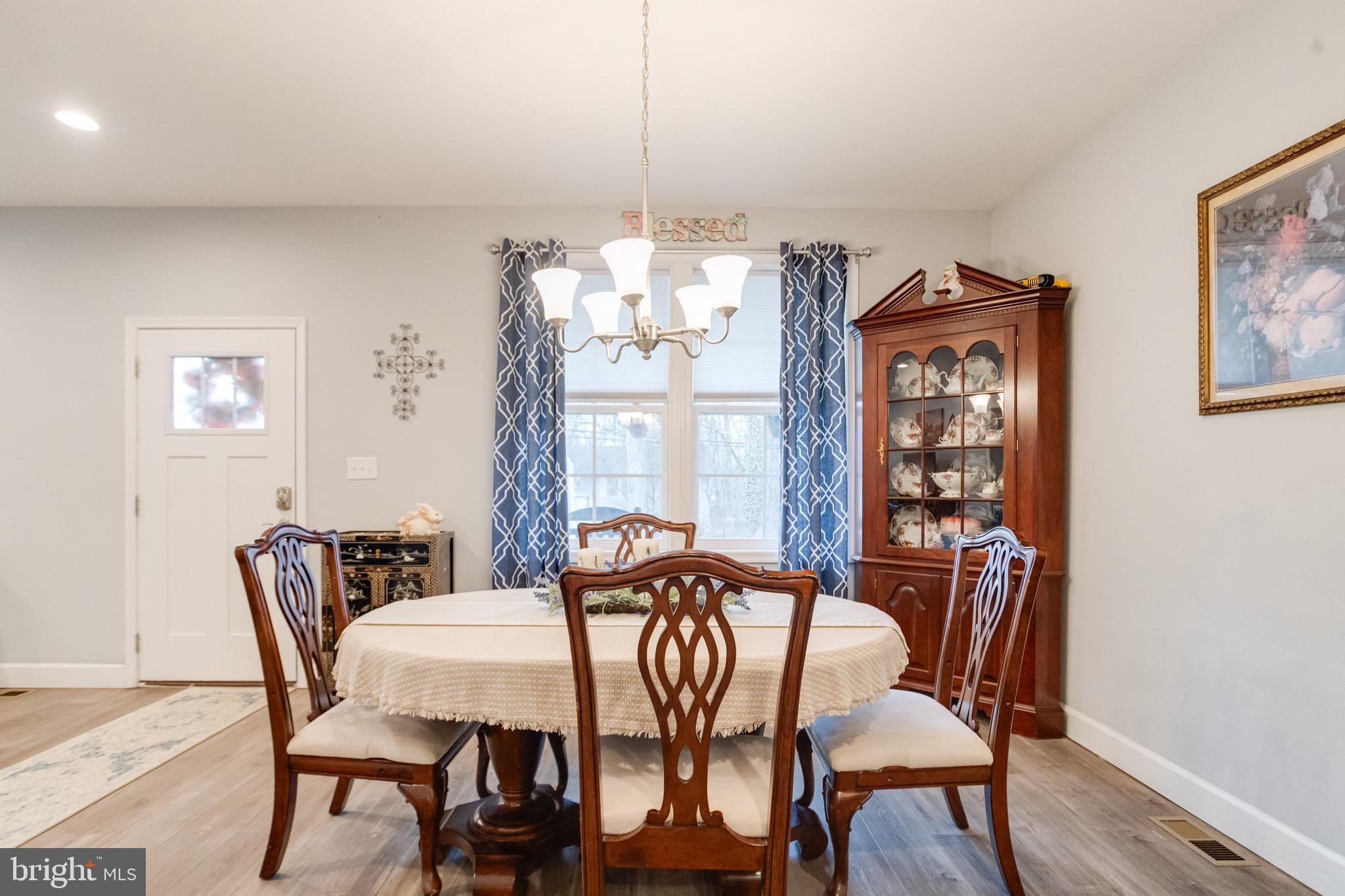 708 Hyde Park Road Essex, MD 21221 - Photo 18 of 65 a view of a dining room with furniture window and wooden floor