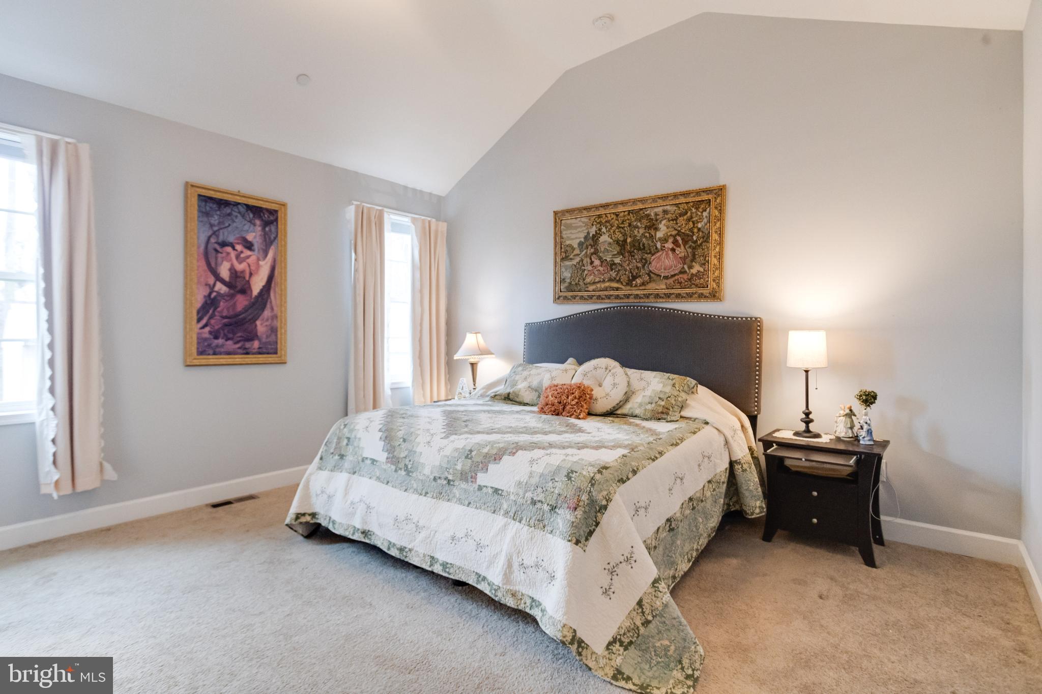 708 Hyde Park Road Essex, MD 21221 - Photo 25 of 65 a spacious bedroom with a bed and a window