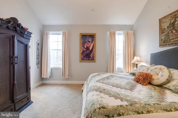 a living room with a couch and a stove top oven