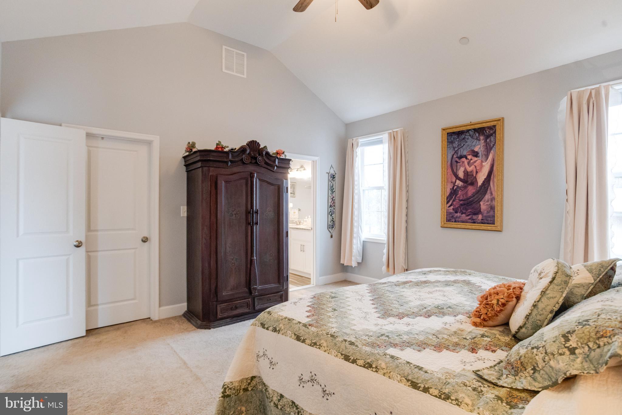 708 Hyde Park Road Essex, MD 21221 - Photo 27 of 65 a bedroom with a bed and a mirror
