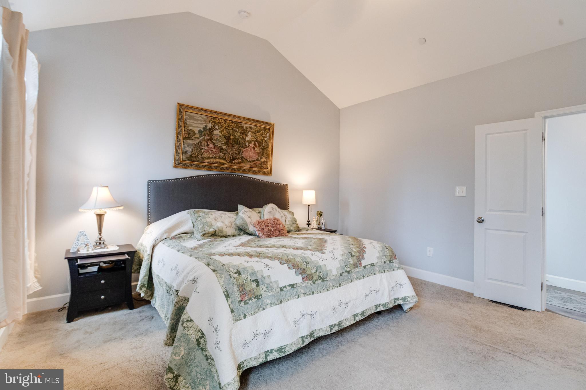 708 Hyde Park Road Essex, MD 21221 - Photo 28 of 65 a bedroom with a bed and a night stand