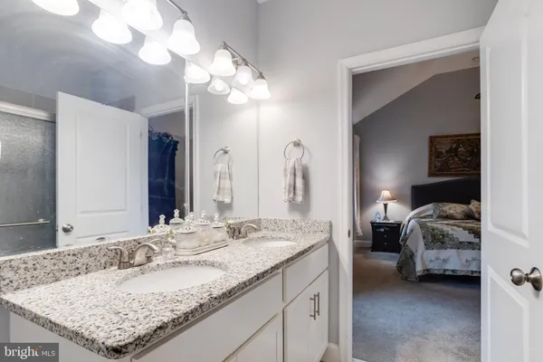 a bathroom with a toilet sink and shower