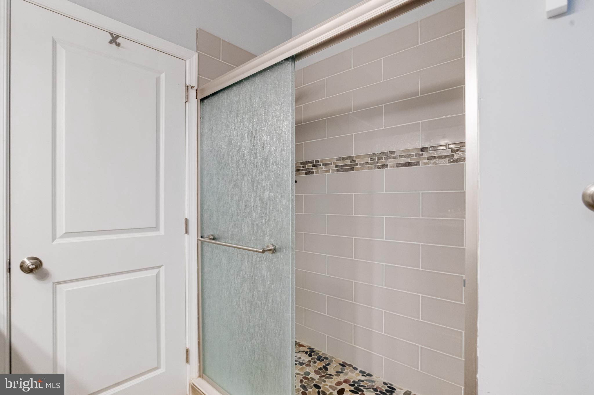 708 Hyde Park Road Essex, MD 21221 - Photo 33 of 65 a bathroom with a glass door shower