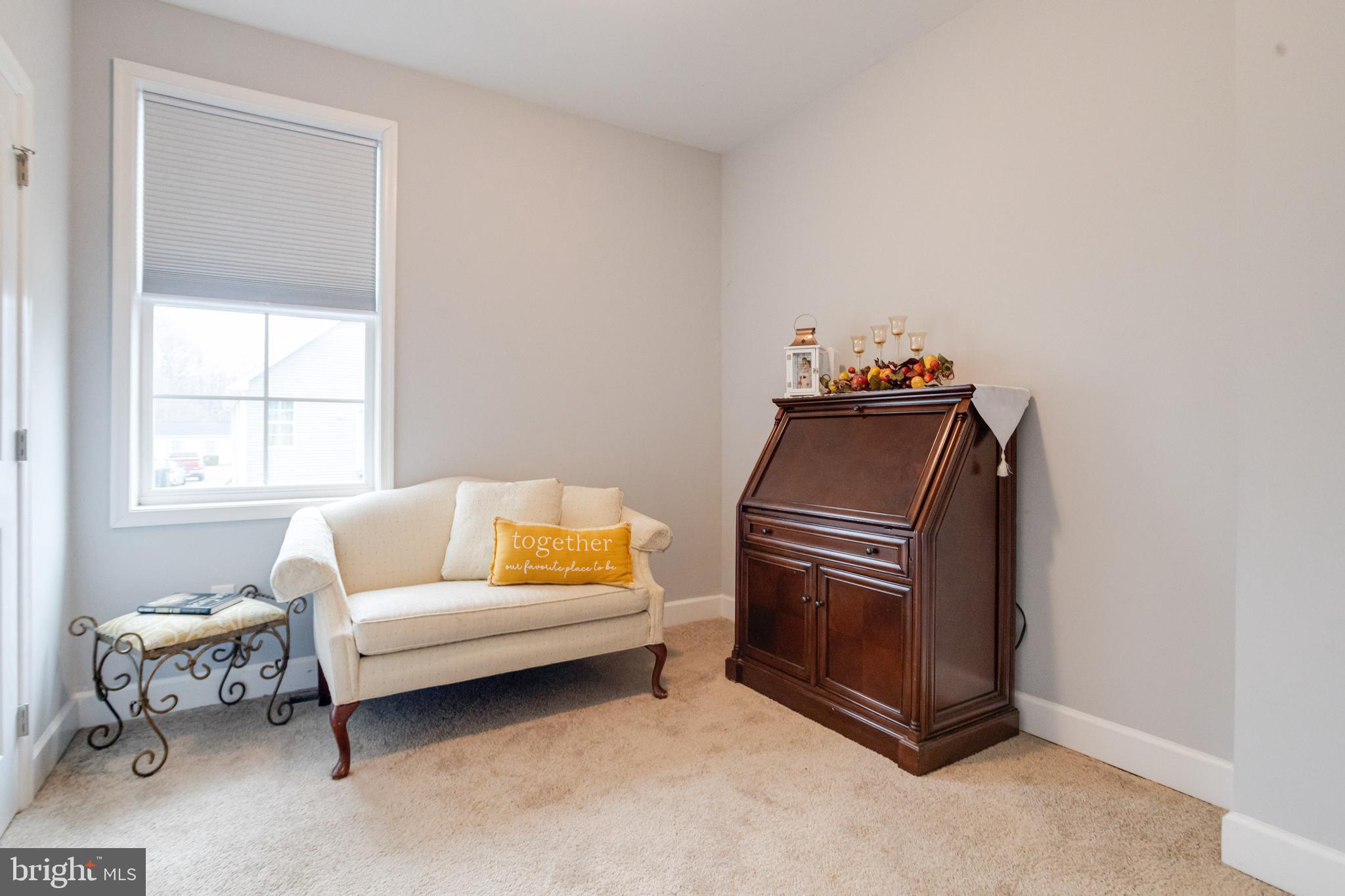 708 Hyde Park Road Essex, MD 21221 - Photo 35 of 65 a living room with furniture and a window