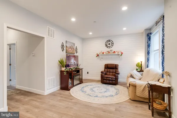 a view of a livingroom with furniture and lounge chair