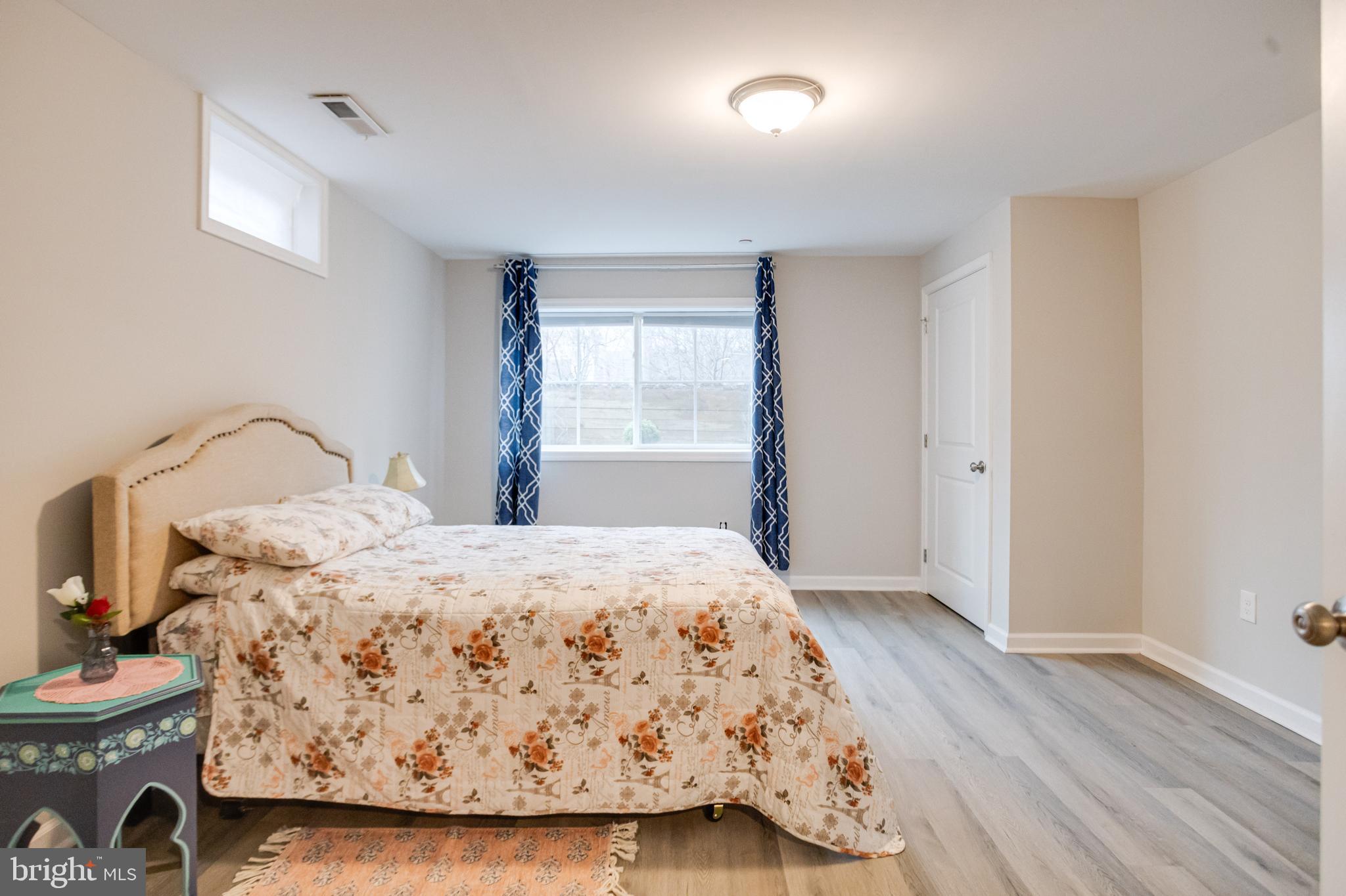 708 Hyde Park Road Essex, MD 21221 - Photo 53 of 65 a bedroom with a bed and a window