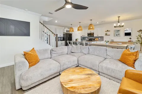 a view of living room with furniture and flat screen tv