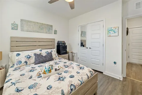 a bedroom with a bed and a dresser