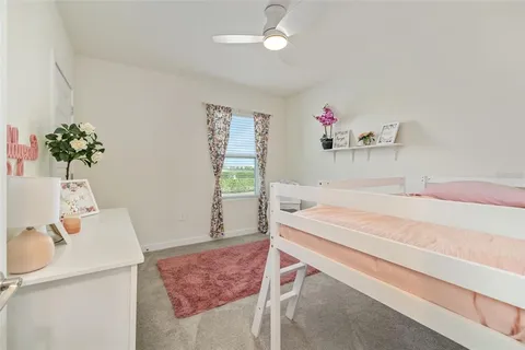a bedroom with a bed and a closet