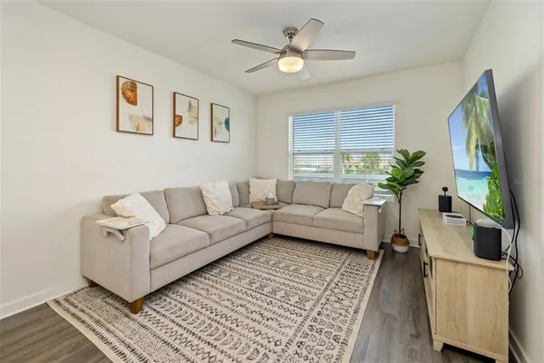 a living room with furniture and a large window