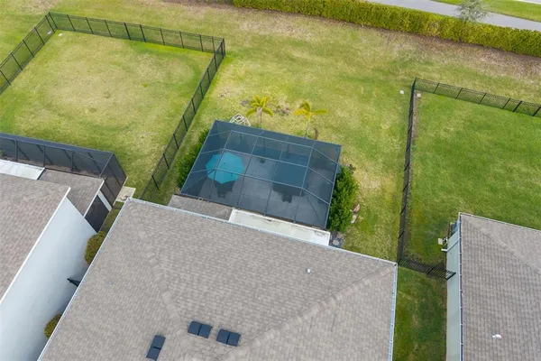 a view of a backyard with plants and a patio