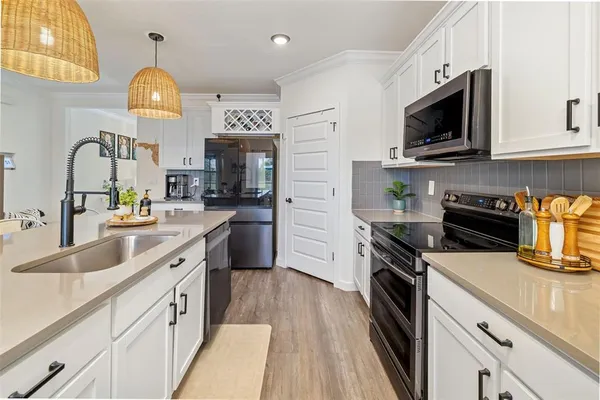 a view of a dining room with furniture and wooden floor