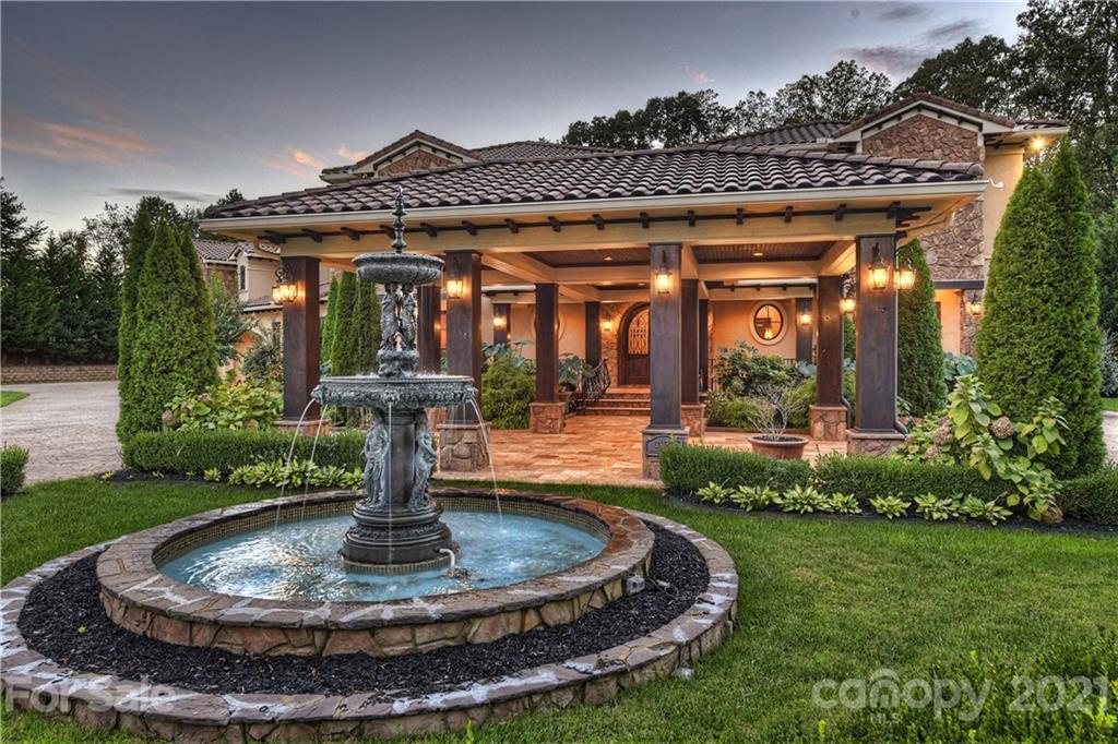 21123 Torrence Chapel Road Cornelius, NC 28031 - Photo 11 of 35 a view of a house with fountain in front of it