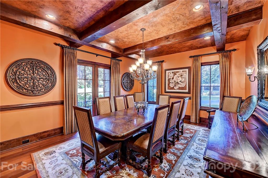 21123 Torrence Chapel Road Cornelius, NC 28031 - Photo 14 of 35 a view of a dining room with furniture window and wooden floor