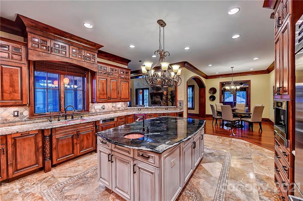 21123 Torrence Chapel Road Cornelius, NC 28031 - Photo 16 of 35 a kitchen that has a lot of cabinets in it