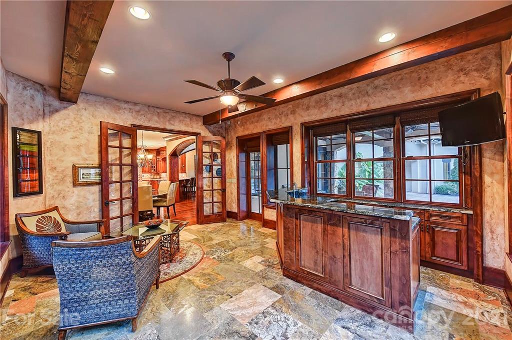 21123 Torrence Chapel Road Cornelius, NC 28031 - Photo 22 of 35 a dining hall with stainless steel appliances granite countertop a stove and a sink