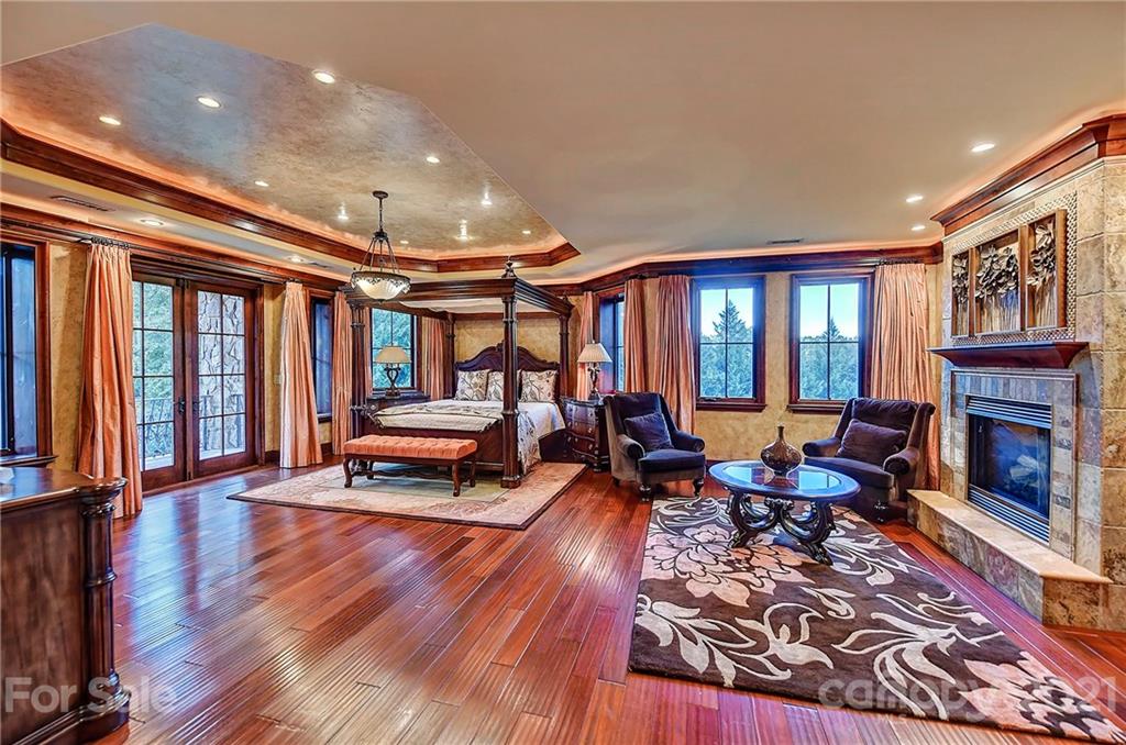 21123 Torrence Chapel Road Cornelius, NC 28031 - Photo 25 of 35 a living room with furniture and a fireplace