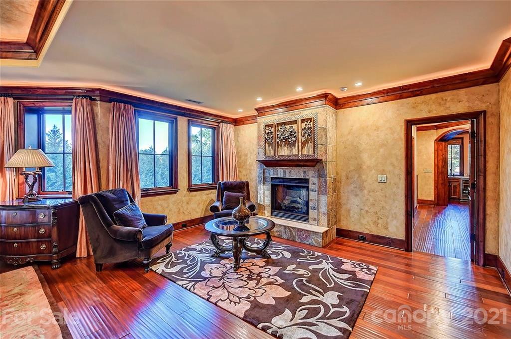 21123 Torrence Chapel Road Cornelius, NC 28031 - Photo 26 of 35 a living room with furniture and a fireplace