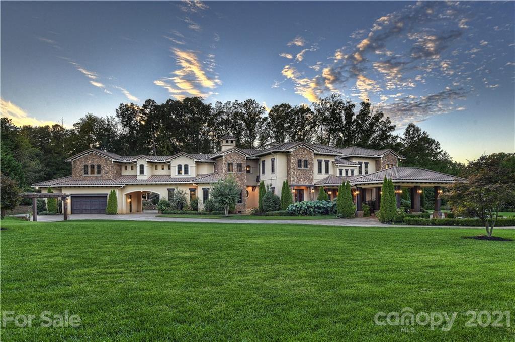 21123 Torrence Chapel Road Cornelius, NC 28031 - Photo 34 of 35 a front view of a house with a garden and yard