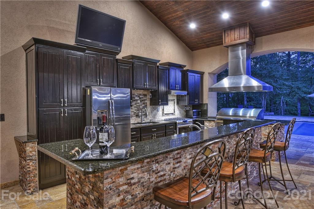 21123 Torrence Chapel Road Cornelius, NC 28031 - Photo 8 of 35 a kitchen with stainless steel appliances granite countertop a sink and a refrigerator