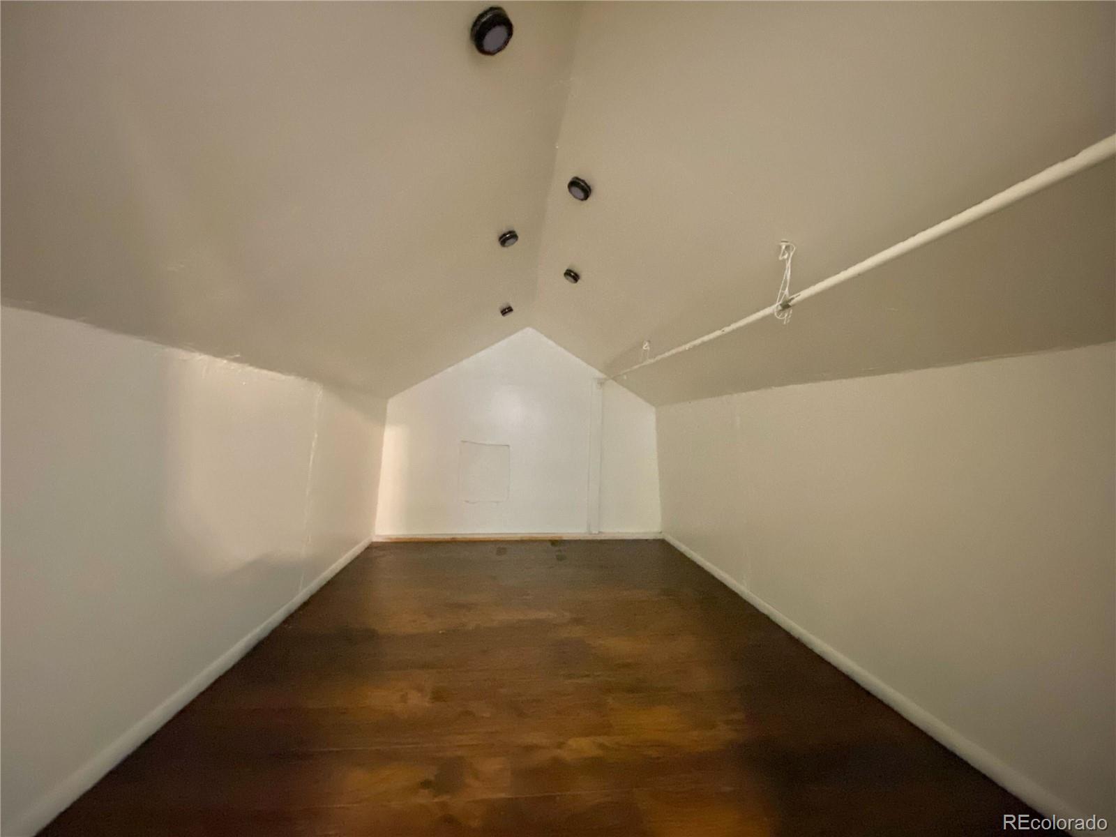 2422 West Vermijo Avenue, Unit 3 Colorado Springs, CO 80904 - Photo 5 of 7 an empty room with a empty space and windows