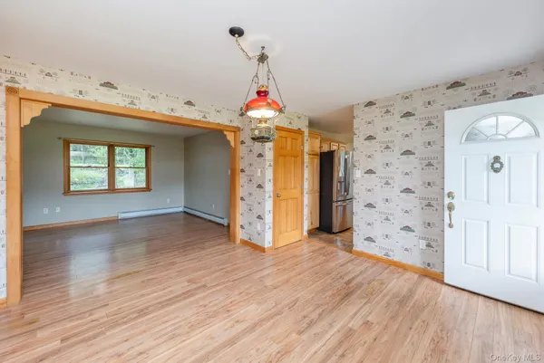 a room with window and wooden floor