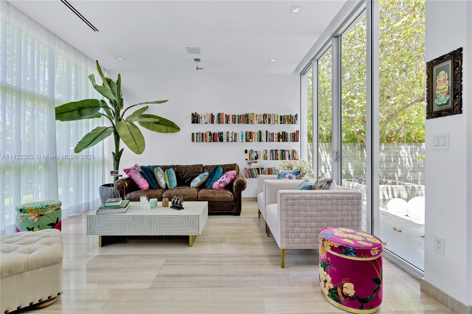 155 Hampton Lane Key Biscayne, FL 33149 - Photo 4 of 19 a living room filled with furniture and a floor to ceiling window