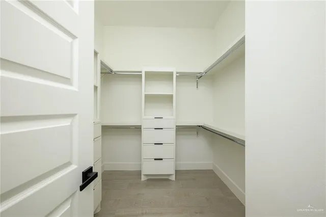 a view of an empty walk in closet