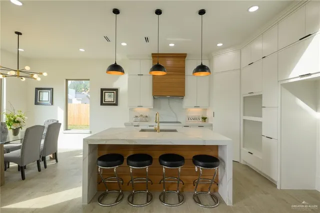 a kitchen with a table and chairs in it