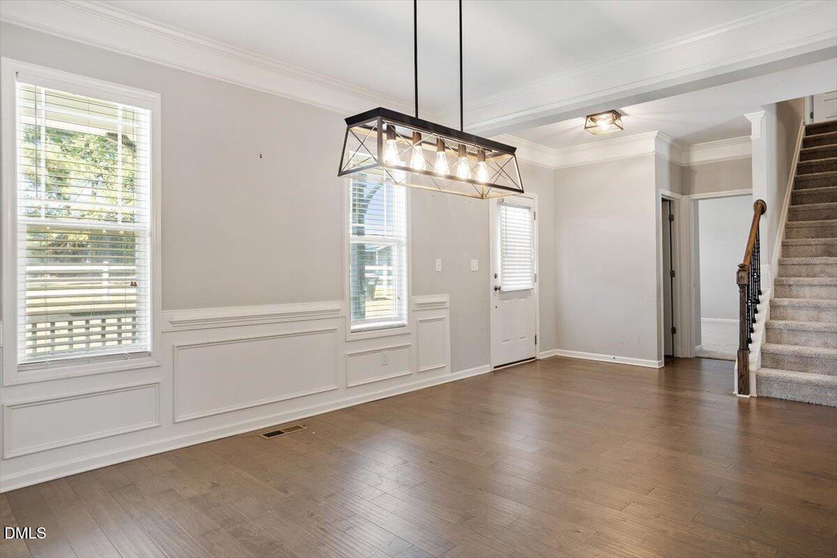 3361 Old Fairground Road Angier, NC 27501 - Photo 13 of 40 a view of an empty room with a window and wooden floor