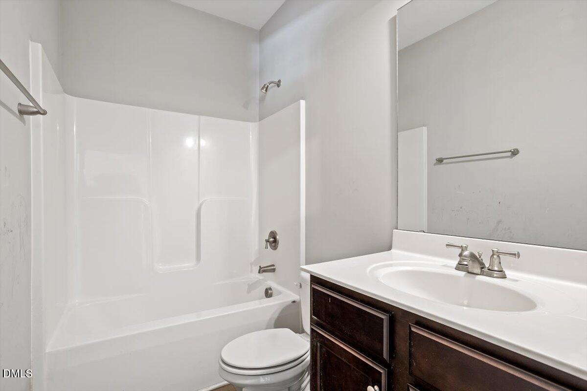 3361 Old Fairground Road Angier, NC 27501 - Photo 14 of 40 a bathroom with a granite countertop sink toilet and shower