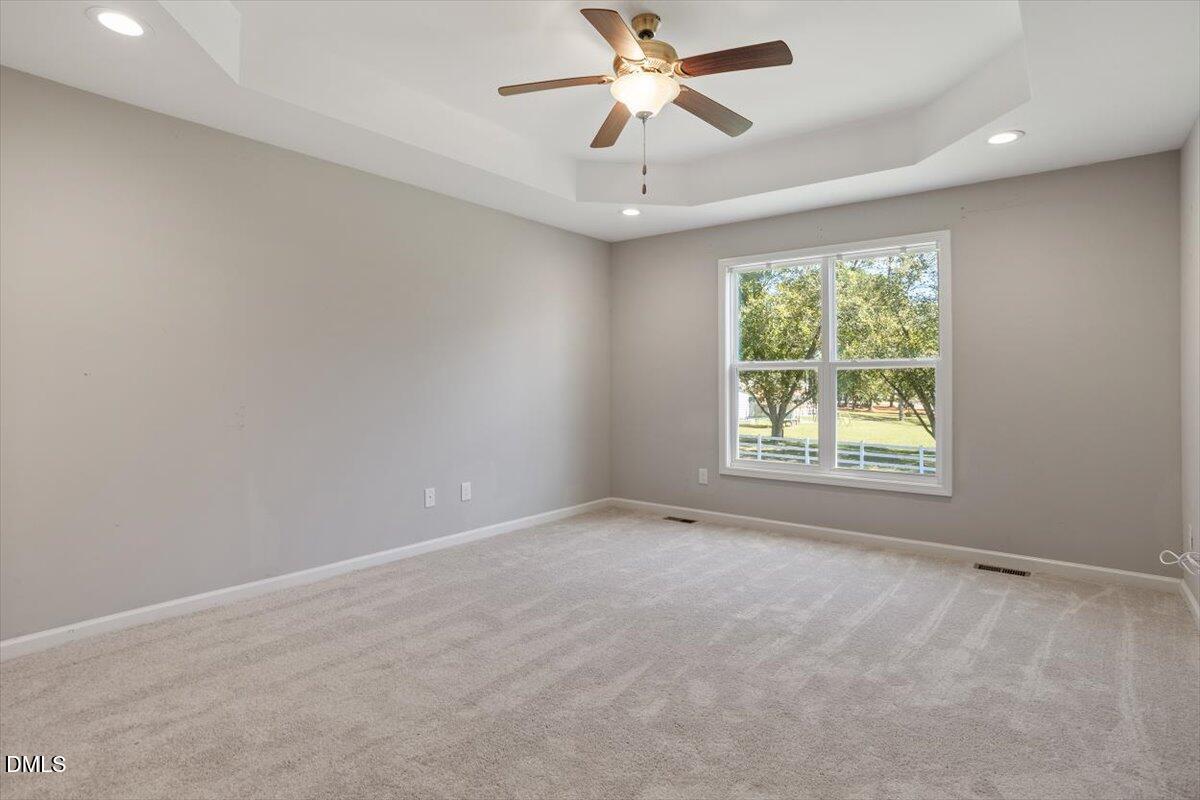 3361 Old Fairground Road Angier, NC 27501 - Photo 28 of 40 an empty room with a window and a fan