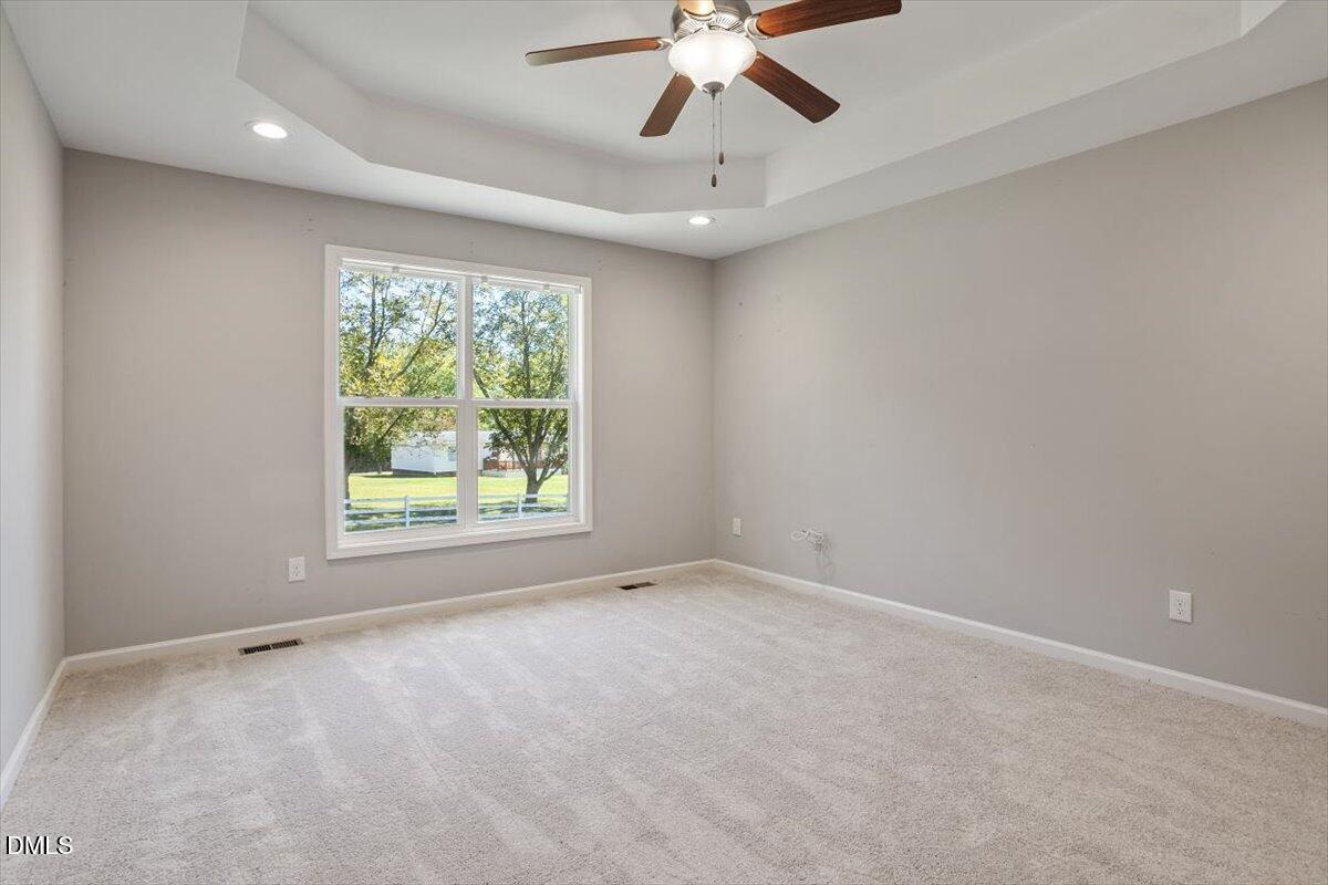3361 Old Fairground Road Angier, NC 27501 - Photo 30 of 40 an empty room with a window and a fan