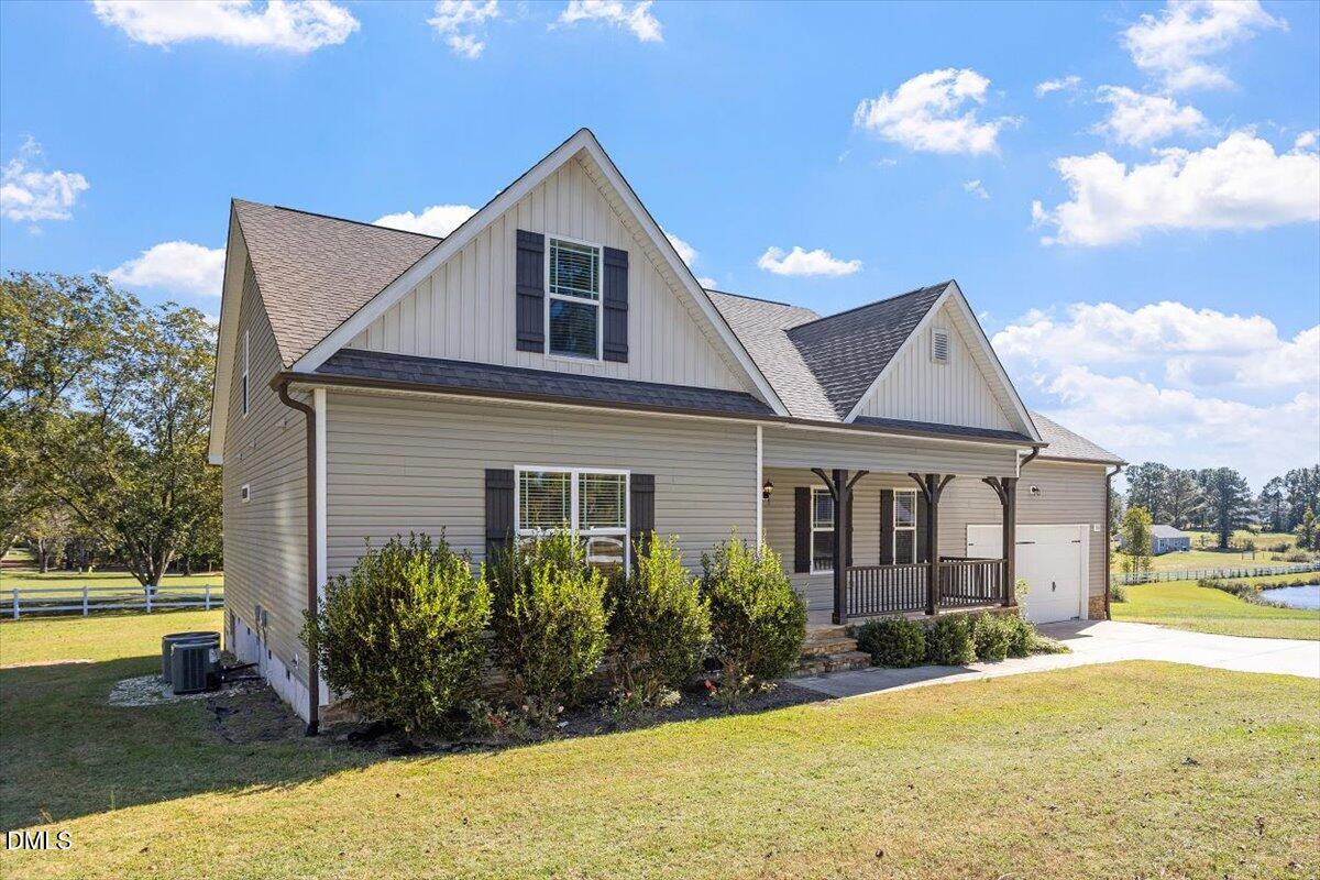 3361 Old Fairground Road Angier, NC 27501 - Photo 3 of 40 a view of a house with swimming pool and a yard
