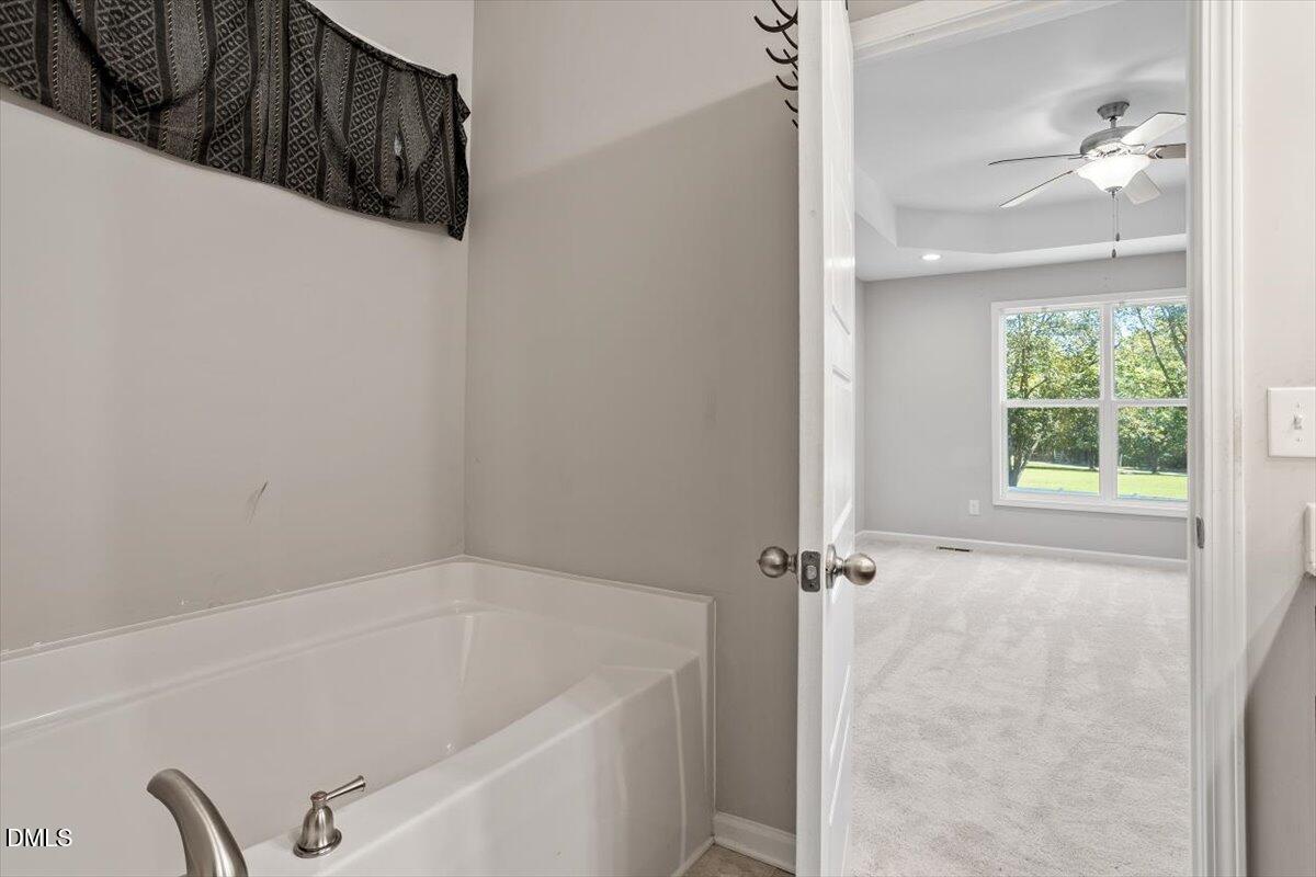 3361 Old Fairground Road Angier, NC 27501 - Photo 32 of 40 a bathroom with a bathtub