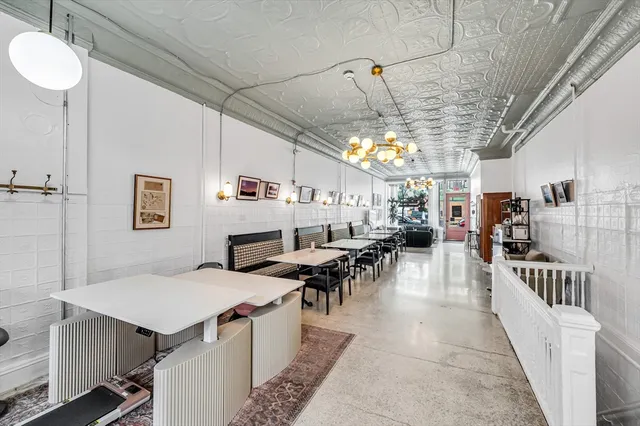 a living room with lots of furniture and a table