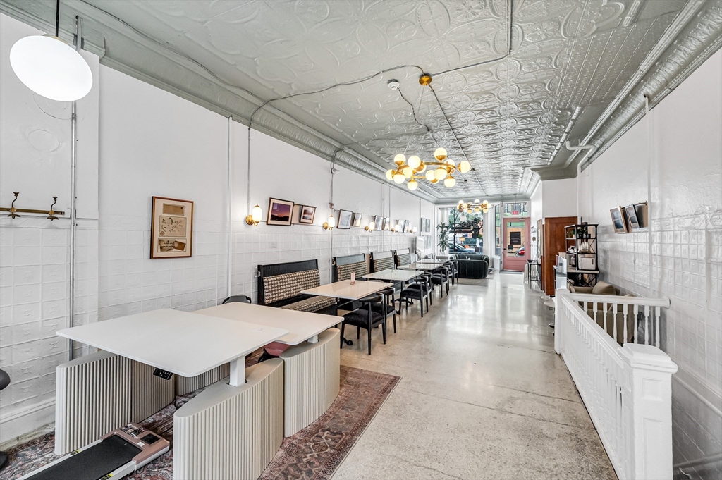 76-96 Maple Street Northampton, MA 01062 - Photo 16 of 22 a living room with lots of furniture and a table