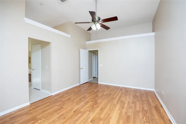 a view of a room with wooden floor