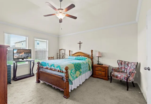 a bedroom with bed and window