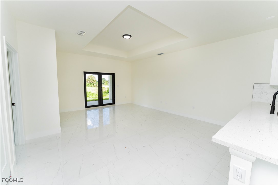 1171 Countess Avenue Lehigh Acres, FL 33974 - Photo 6 of 15 a view of an empty room with a window