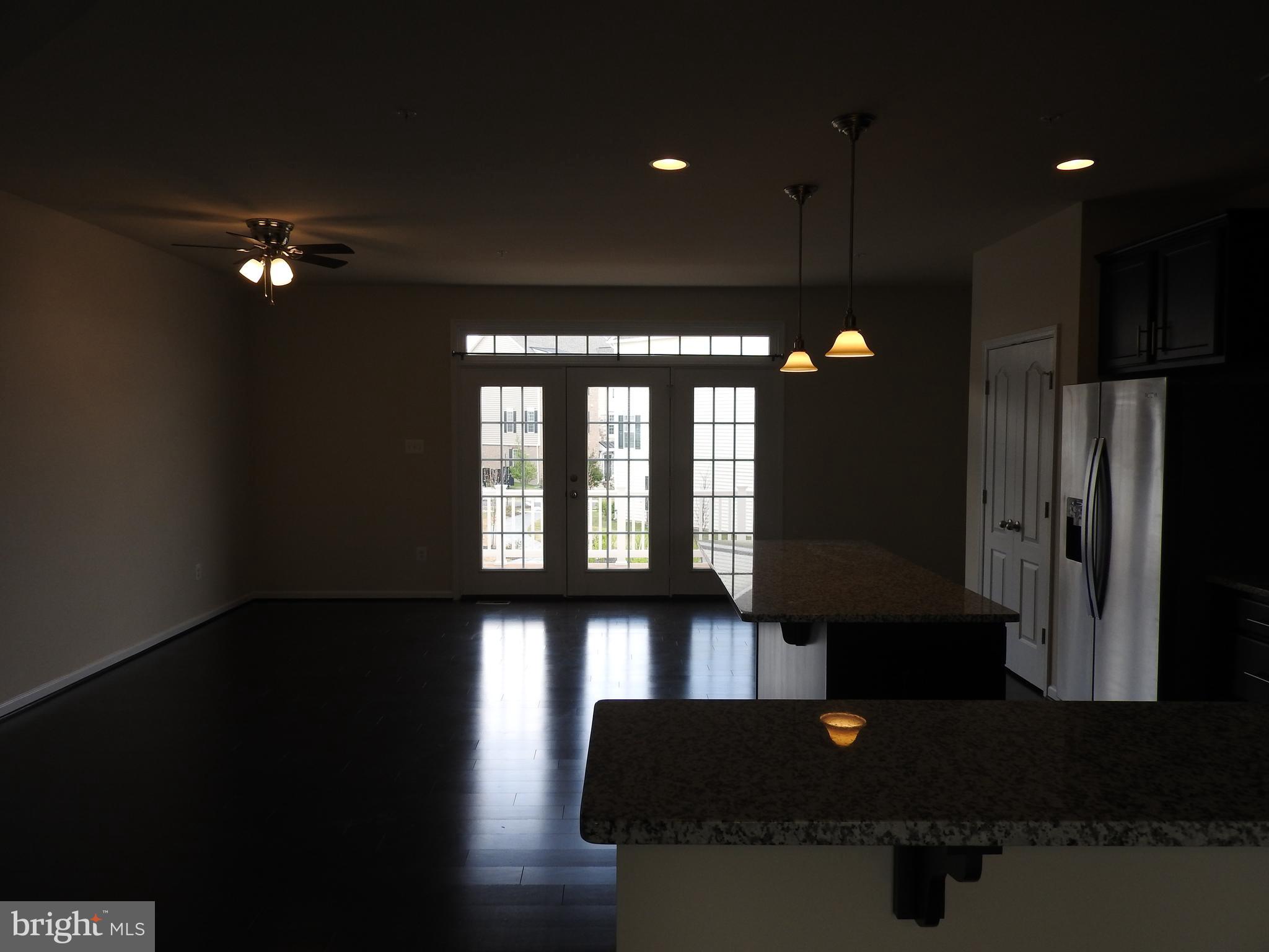 7863 Wormans Mill Road Frederick, MD 21701 - Photo 19 of 37 View from family room to kitchen and doors leading