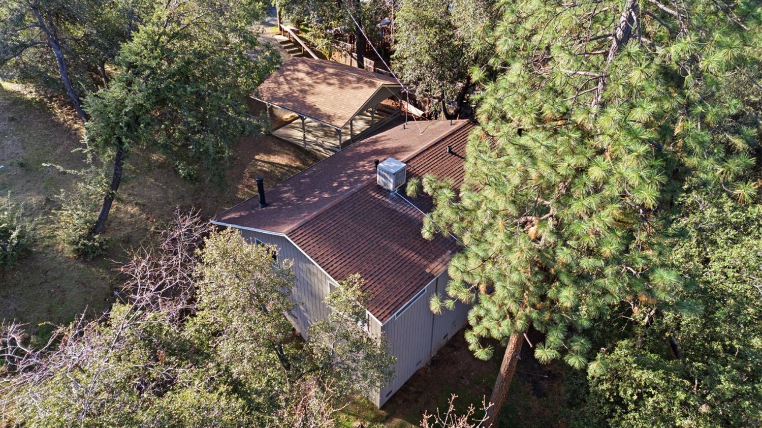 19088 Hillhaven Road Tuolumne, CA 95379 - Photo 20 of 27 an aerial view of a house with a yard and large trees